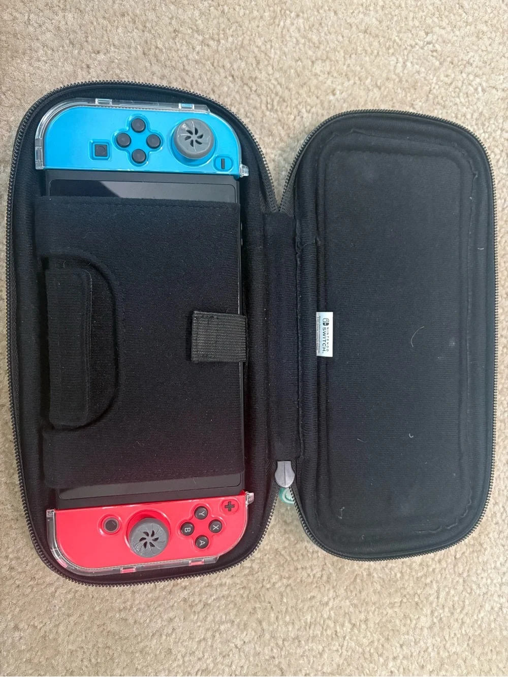 Nintendo Switch with Blue and Red Joy‑Con in Travel Case